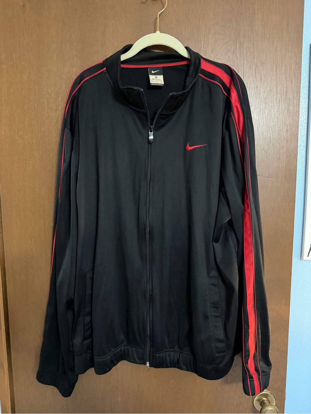 Nike Black Jacket with Red Stripe Detail